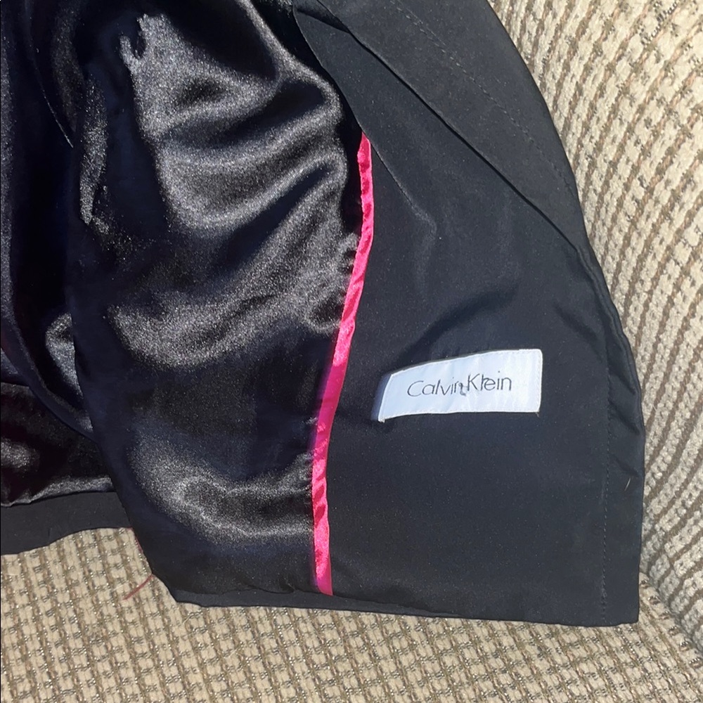 Calvin Klein’s women’s Black Coat with Pink Lining